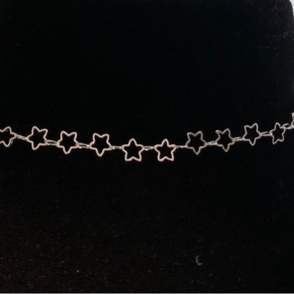 Silver coloured star necklace